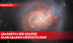 Galaksinin ana gövdesinden uzanan parlak ve uzun dallar, şiddetli bir olaydan miras