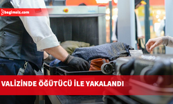 Valizinde uyuşturucu madde içeren öğütü ile yakalandı