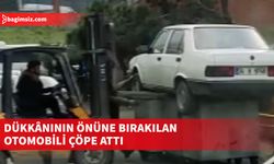 İstanbul Bağcılar Sanayisi'nde bir esnaf dükkanının önüne park edilen aracı çöp konteynerinin üstüne koydu