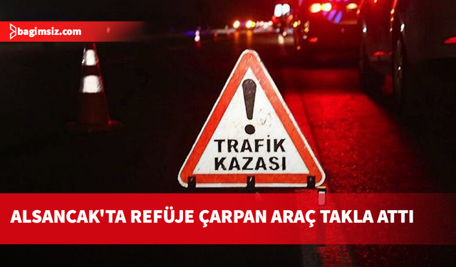 Alsancak'ta refüje çarpan araç takla attı